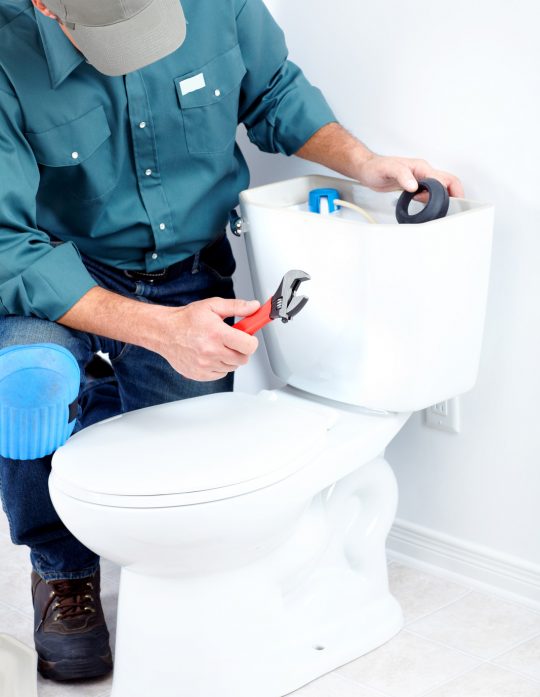 Plumber fixing a toilet in Narrabeen Plumber fixing a toilet in Narrabeen